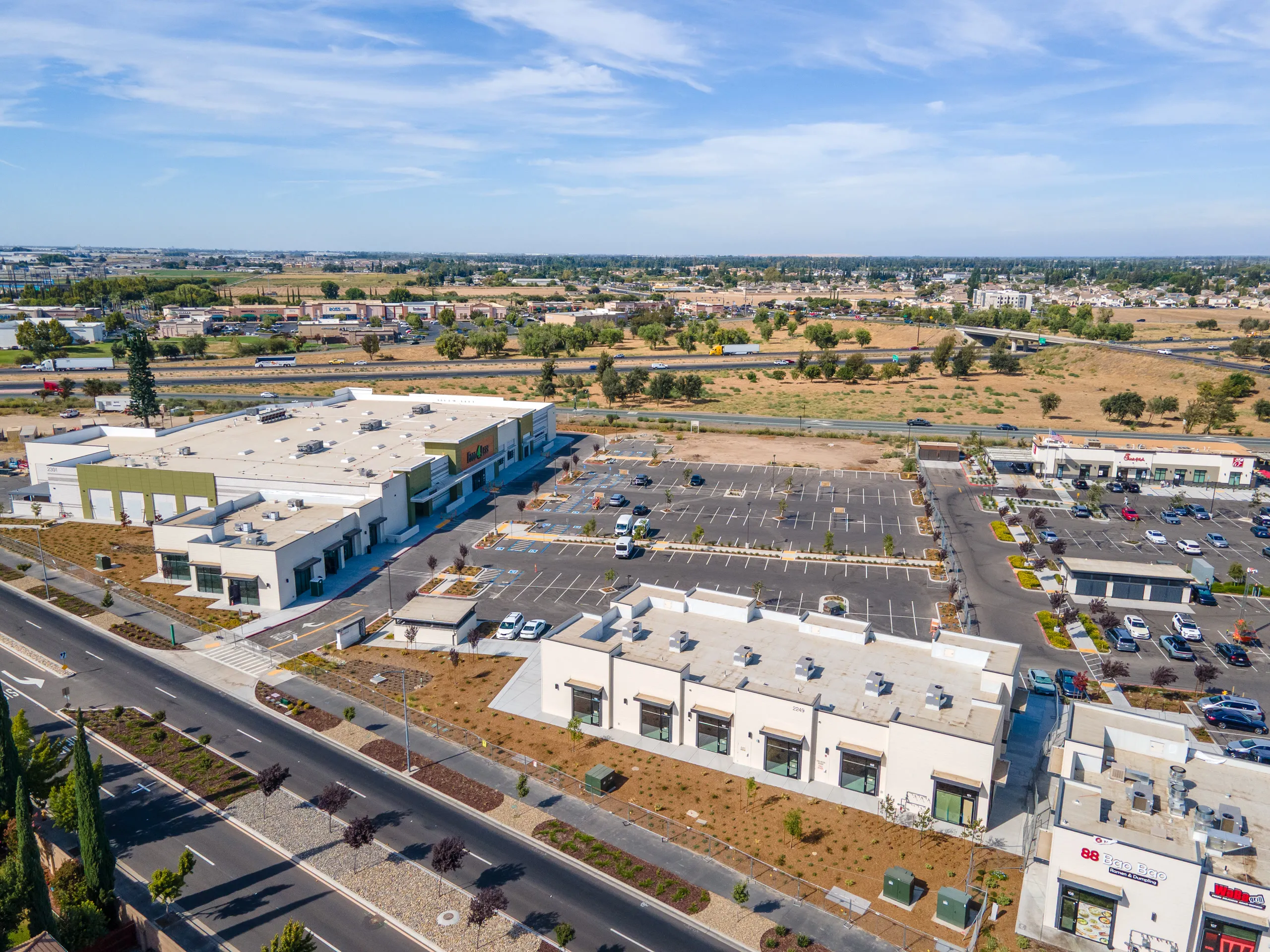 Aerial view of the Shops J building with Food 4 Less and Shops H behind it and Shops A to the right